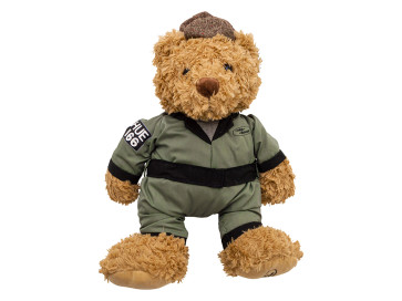 Golden brown, extra soft teddy bear with Green HUE 166 overalls and a brown flat cap.
